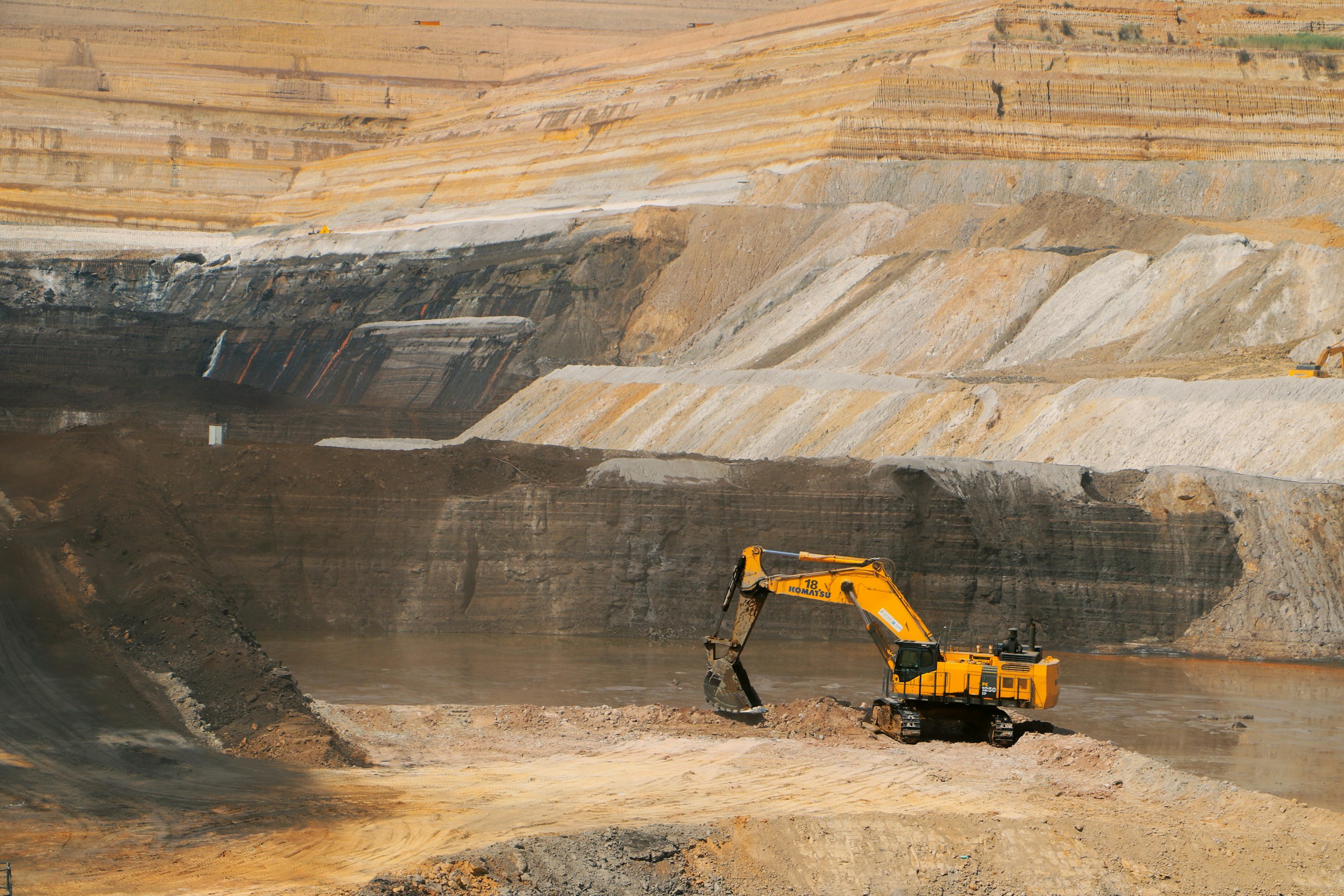 Excavator working a UK quarry face